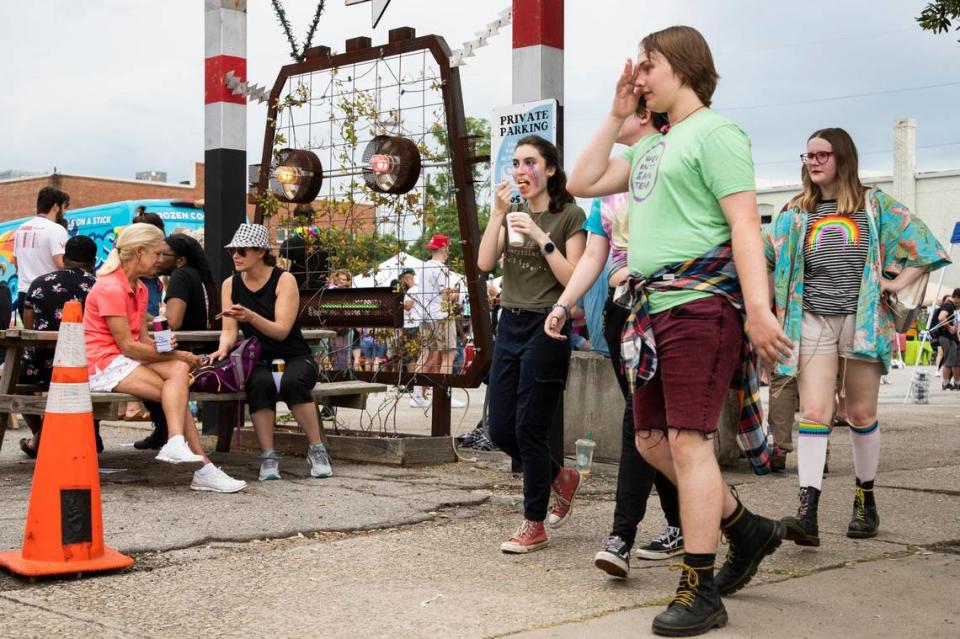 Families and groups of friends walk around as dance music plays at OutFest in Columbia, South Carolina on Saturday, June 6, 2021. The LGBT pride festival was cancelled last year to prevent the spread of the coronavirus.