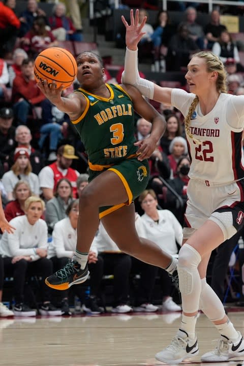Norfolk State guard Diamond Johnson, left, shoots while defended by Stanford forward Cameron Brink during the first half of a first-round college basketball game in the women’s NCAA Tournament in Stanford, Calif., Friday, March 22, 2024. (AP Photo/Godofredo A. Vásquez)