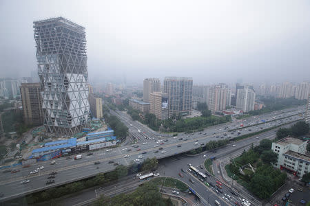 An uncompleted building is seen next to the Fourth Ring Road in Beijing, China July 16, 2018. REUTERS/Jason Lee