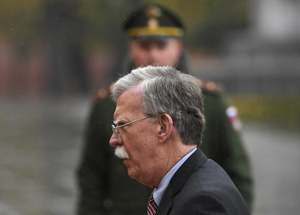 U.S. National Security Adviser John Bolton attends a wreath laying ceremony at the Tomb of the Unknown Soldier by the Kremlin wall in Moscow, Russia, Tuesday, Oct. 23, 2018. U.S. President Donald Trump's national security adviser Bolton struck a conciliatory note Tuesday in talks in Moscow, just days after Trump vowed to pull out of a key arms control treaty with Russia. (Kirill Kudryavtsev/Pool Photo via AP)