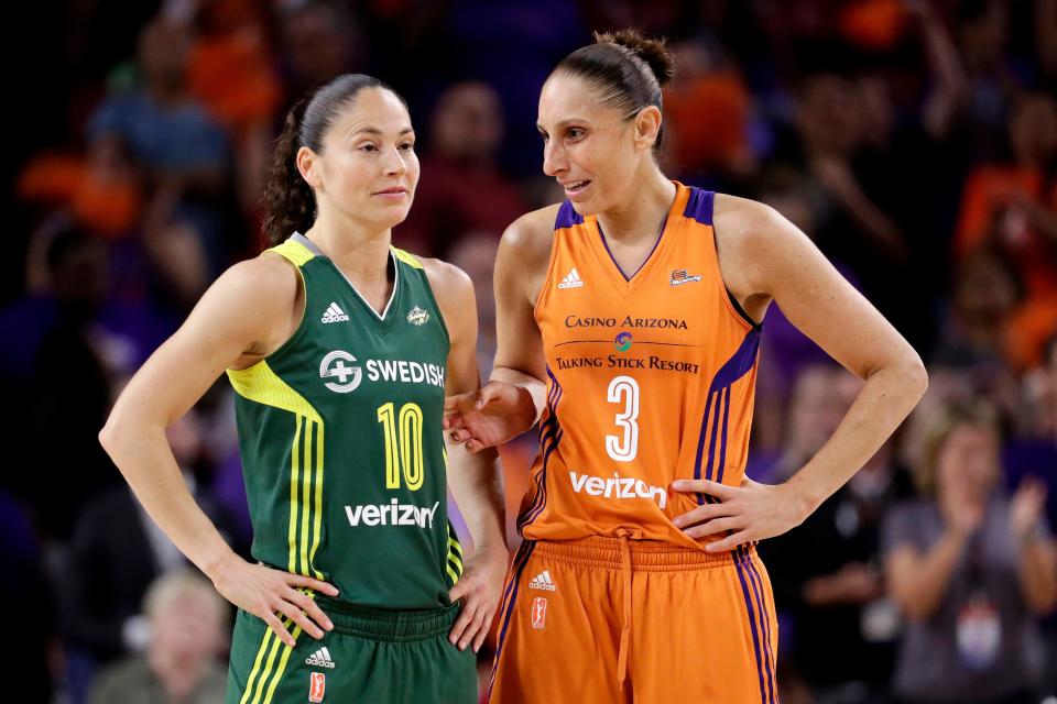 Phoenix Mercury guard Diana Taurasi (3) talks with Seattle Storm guard Sue Bird (10)  will try and become the first players ever to win five Olympic gold medals in basketball when the United States women's team begins play at the Tokyo Games.