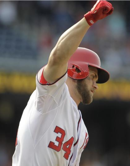 Bryce Harper celebrates his two-run, game-winning homer Thursday. (AP Photo)