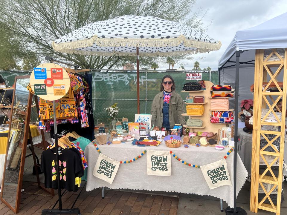 Erin Clephas-Schulz sells sustainable goods at the fifth annual Slacker Holiday Gift Market on Roosevelt Street in Phoenix on Dec. 23, 2023.