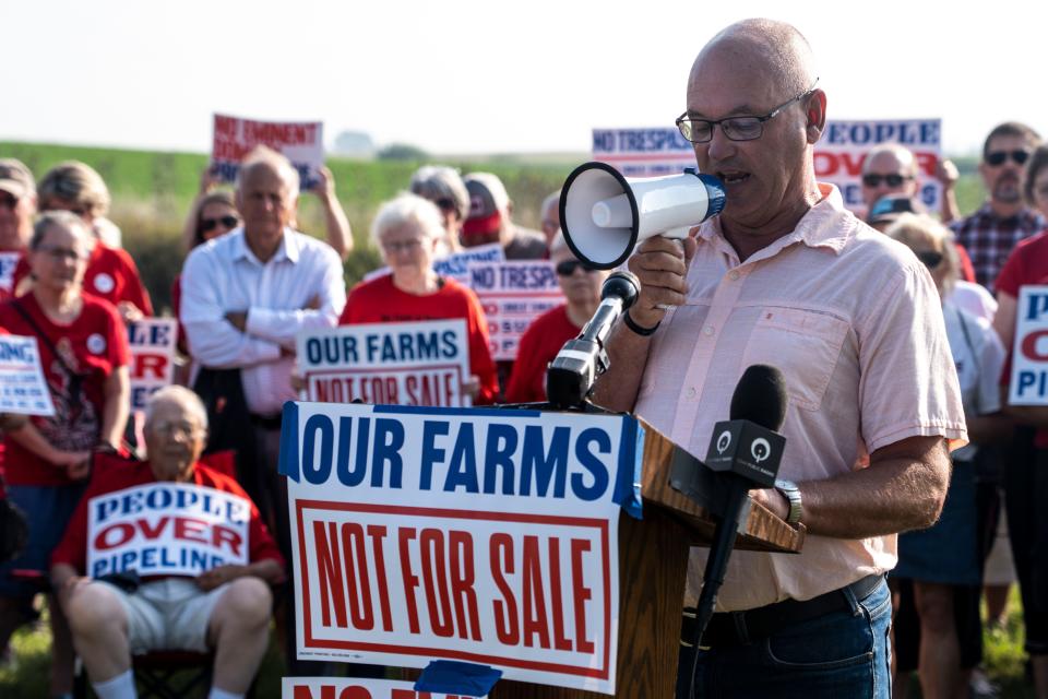 Steve Kenkel, chair of the Shelby County Board of Supervisors, speaks during a news conference held by opponents of the Summit Carbon Solutions pipeline as the Iowa Utilities Board, meeting in Fort Dodge, opened its hearing Aug. 22 on a permit for the project.