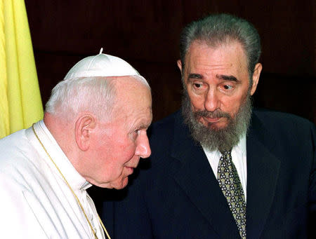 Then Cuban President Fidel Castro talks to then Pope John Paul II during the presentation of their delegations at the Palace of the Revolution in Havana in this January 22, 1998 file photo. REUTERS/Paul Hanna/File Photo