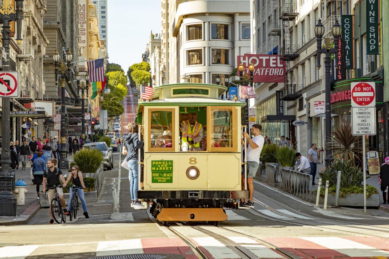 San Francisco, USA - May 20, 2022: historic  Cable Car Powell Hyde Line on turntable at Powell Street terminal at Market Street in downtown San Francisco, California CA, USA.