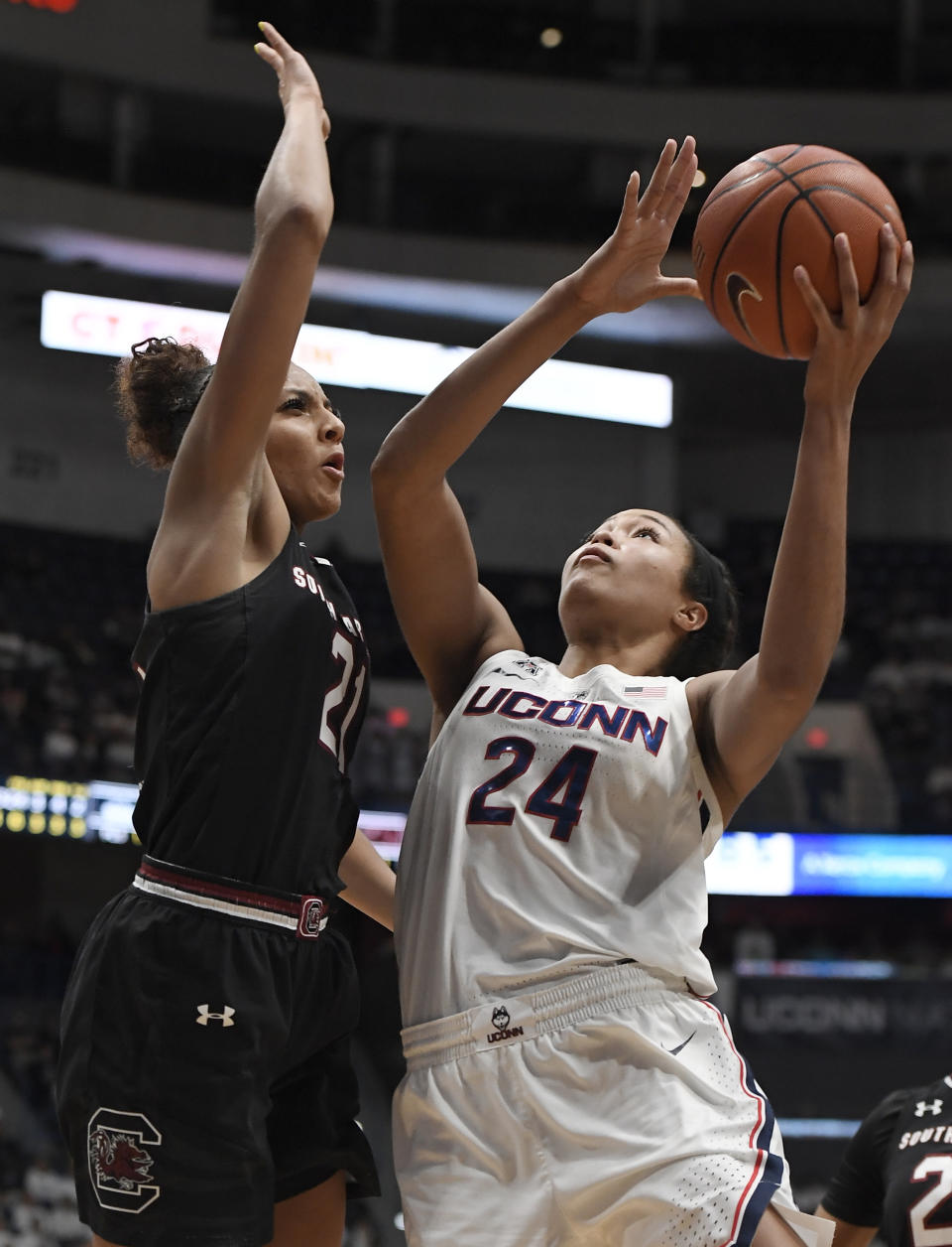 Connecticut's Napheesa Collier, right, shoots over South Carolina's Mikiah Herbert Harrigan during the second half of an NCAA college basketball game, Monday, Feb. 11, 2019, in Hartford, Conn. (AP Photo/Jessica Hill)