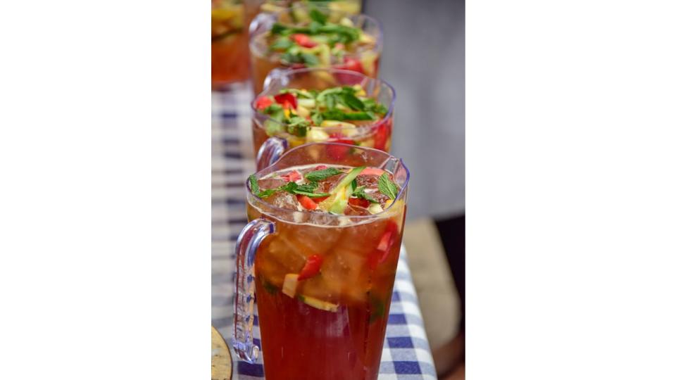 Jugs of Pimm's on a table with checked table cloth