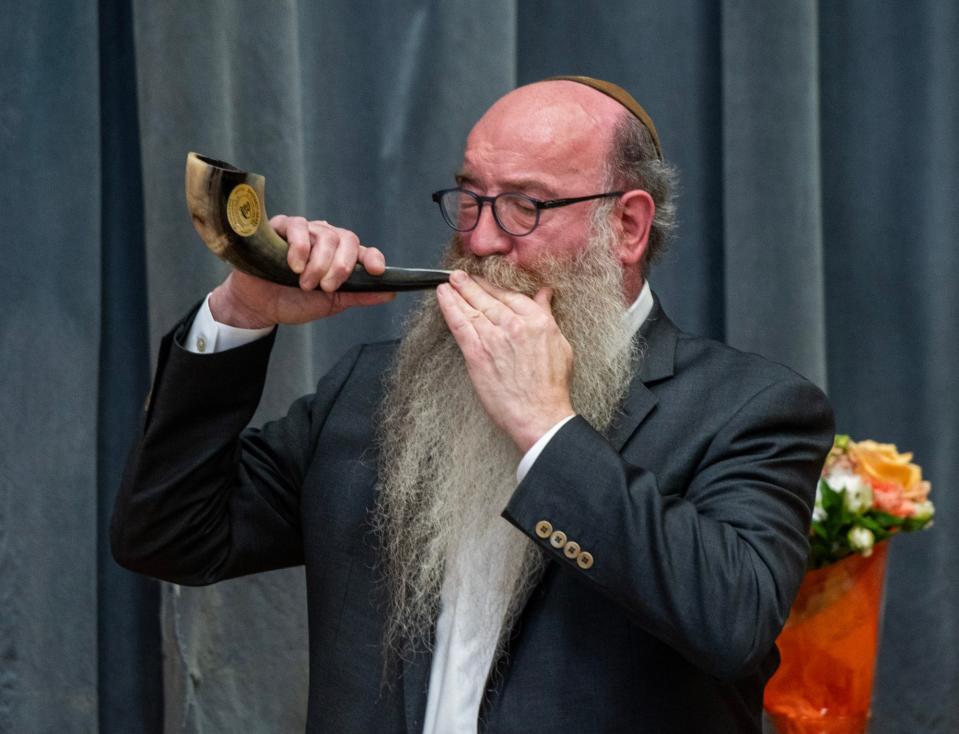 Rabbi Levi Liberow blows the shofar during a ceremony where the Jewish Federation of Central Massachusetts awarded former Lt. Gov. Karyn Polito the Righteous Gentile Humanitarian Award Wednesday in Worcester.