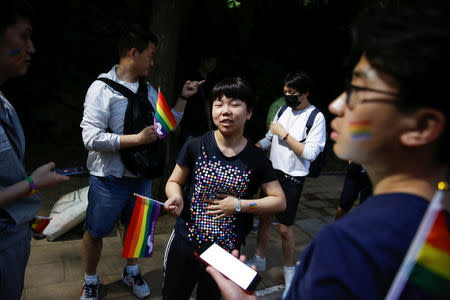 Participants get ready for a 5.17 km run to mark International Day Against Homophobia in a park in Beijing, China, May 17, 2018. REUTERS/Thomas Peter