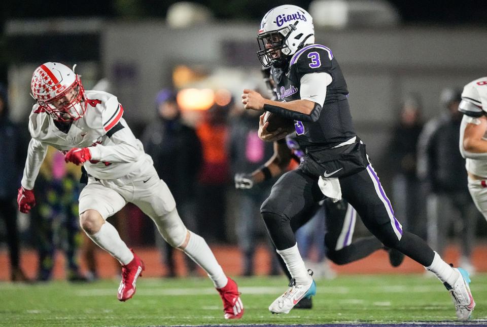 Ben Davis Giants quarterback Thomas Gotkowski (3) rushes up the field Friday, Nov. 17, 2023, during the IHSAA semi state championship game at Ben Davis High School in Indianapolis. The Ben Davis Giants defeated the Center Grove Trojans in overtime, 37-34.