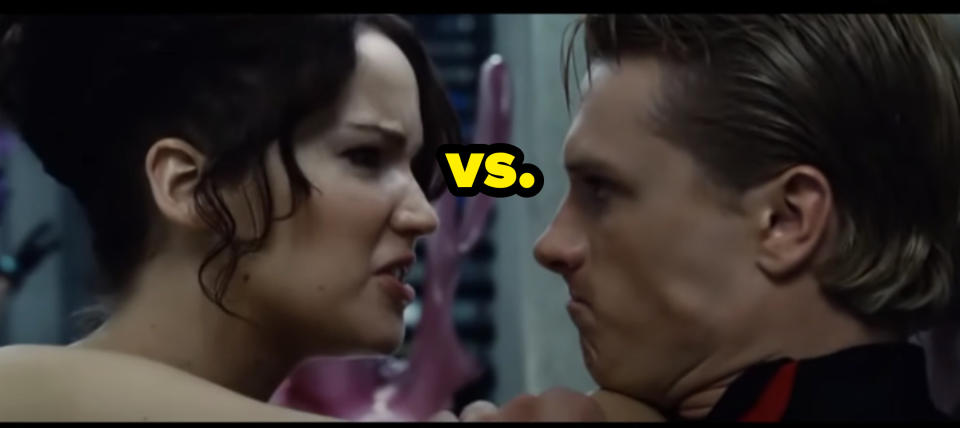 Katniss angrily pushing Peeta up against the wall with her elbow in his neck with the caption "vs."