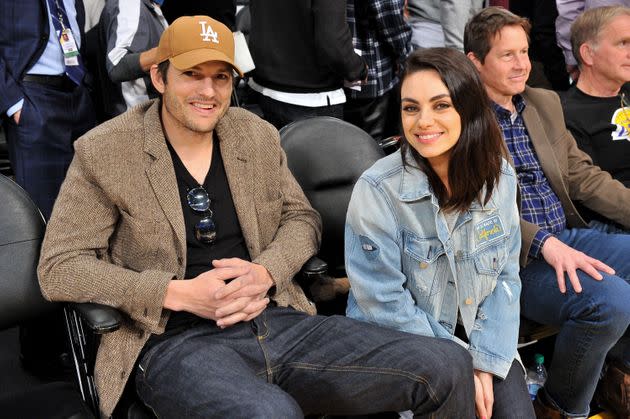 Ashton Kutcher and Mila Kunis at a basketball game in 2019. (Photo: Allen Berezovsky via Getty Images)