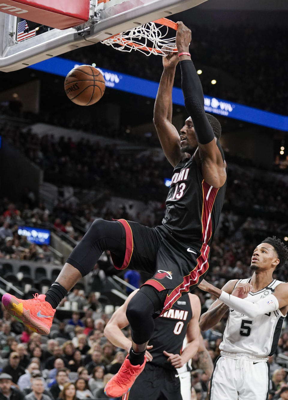 Miami Heat's Bam Adebayo dunks during the first half of an NBA basketball game against the San Antonio Spurs, Sunday, Jan. 19, 2020, in San Antonio. (AP Photo/Darren Abate)