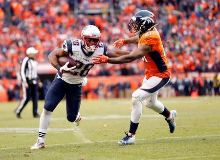 New England Patriots cornerback Darryl Roberts (28) runs against Denver Broncos cornerback Aqib Talib (21) in the second half in the AFC Championship football game at Sports Authority Field at Mile High. Kevin Jairaj-USA TODAY Sports