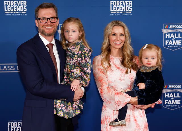 <p>Chris Graythen/Getty</p> Dale Earnhardt Jr. and Amy Earnhardt with their daughters, Isla and Nicole, in 2022