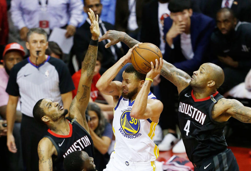 With Trevor Ariza and P.J. Tucker dogging opposing scorers on the wings, the Rockets rose up the defensive rankings and made it all the way to Game 7 of the Western Conference finals. (Getty)