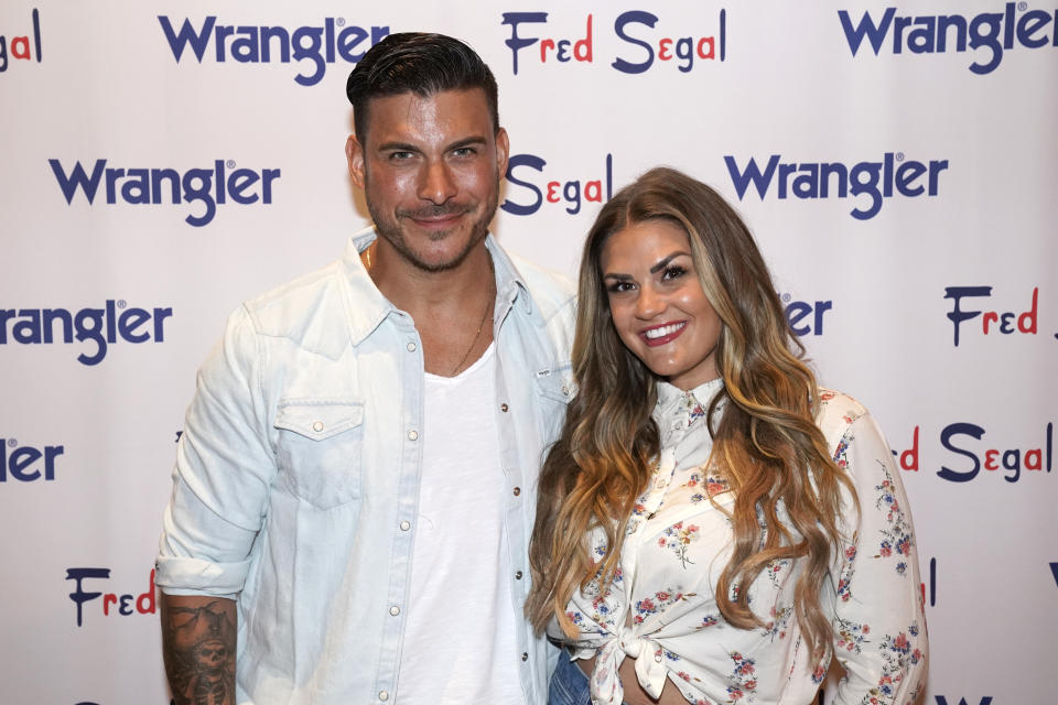Jax Taylor and Brittany Cartwright pose for a photo during a Wrangler event