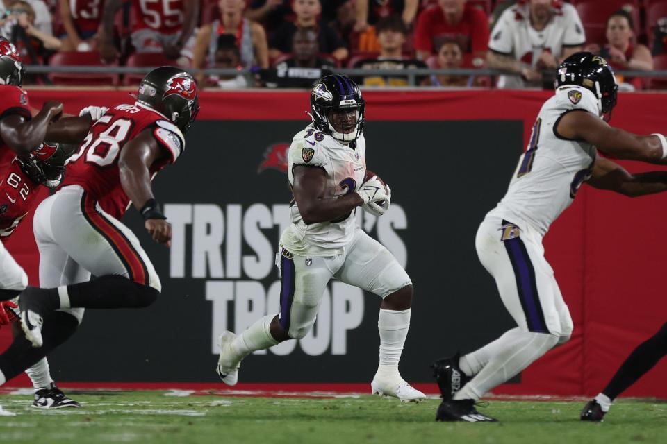 Aug 26, 2023; Tampa, Florida, USA; Baltimore Ravens running back Owen Wright (36) runs with the ball against the Tampa Bay Buccaneers during the second half at Raymond James Stadium. Mandatory Credit: Kim Klement Neitzel-USA TODAY Sports