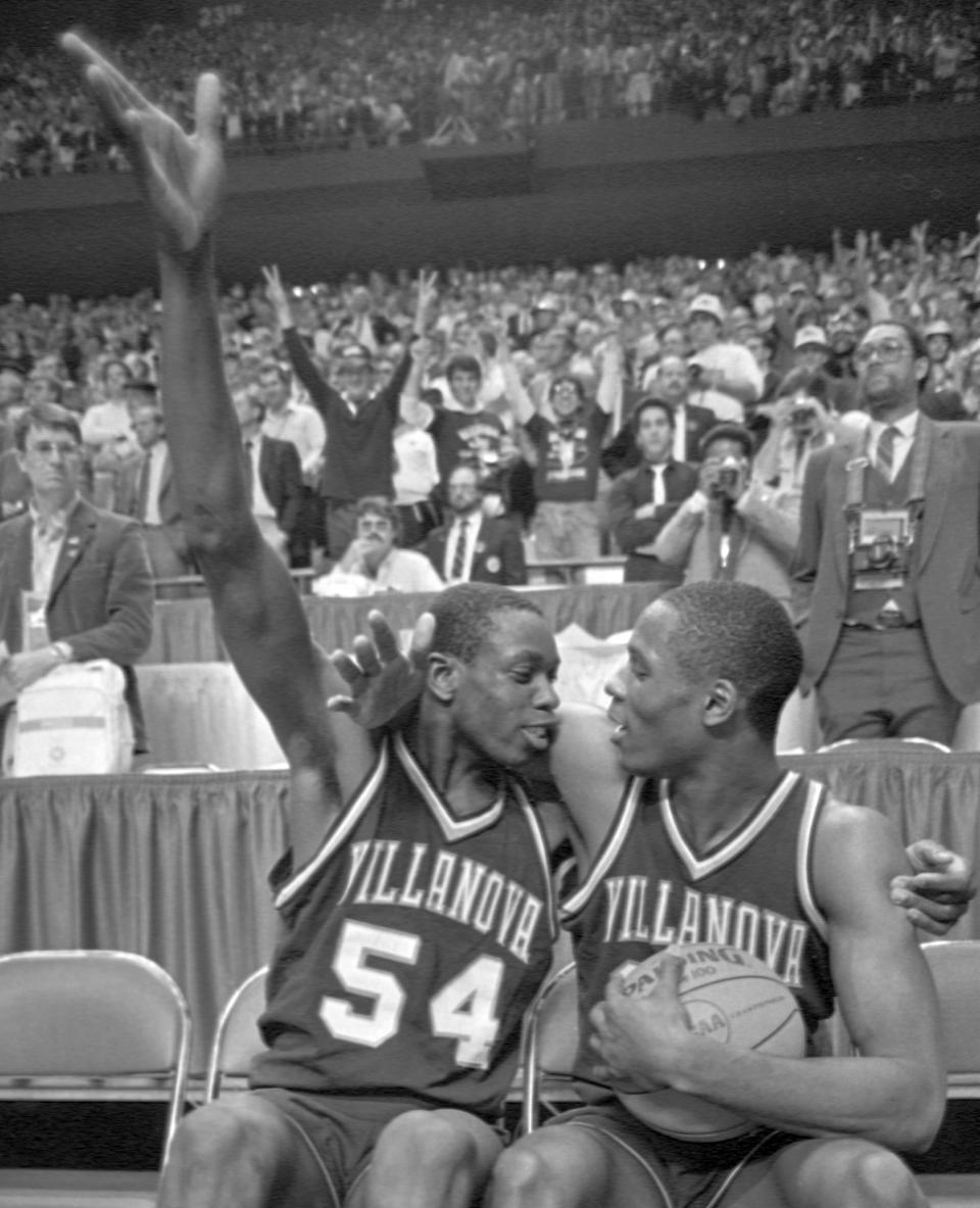 FILE - In this April 1, 1985, file photo, Villanova's Ed Pinckney (54) and Dwayne McLain celebrate after playing their last college basketball game, upsetting Georgetown 66-64 in the NCAA college basketball Final Four championship game, in Lexington, Ky. (AP Photo/File)