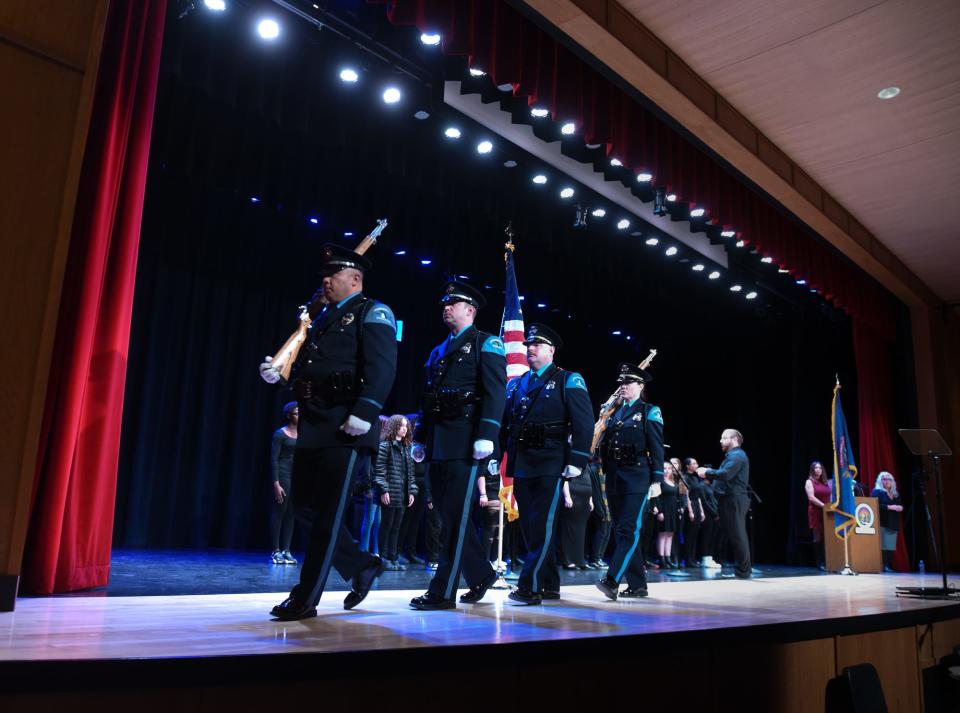 Members of the Lansing Police Department Honor Guard exit after the Presentation of Colors prior to Lansing Mayor Andy Schor's sixth annual State of the City address Tuesday, March 14, 2023, in the Everett High School auditorium in Lansing.