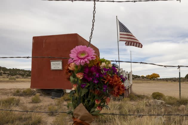 FILE – Flowers are seen in the entrance to the film set of 