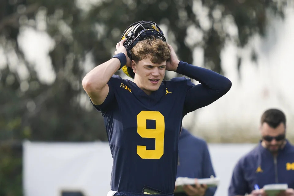 Michigan quarterback J.J. McCarthy warms up during practice Friday, Dec. 29, 2023, in Carson, Calif. Michigan is scheduled to play against Alabama on New Year's Day in the Rose Bowl, a semifinal in the College Football Playoff. (AP Photo/Ryan Sun)