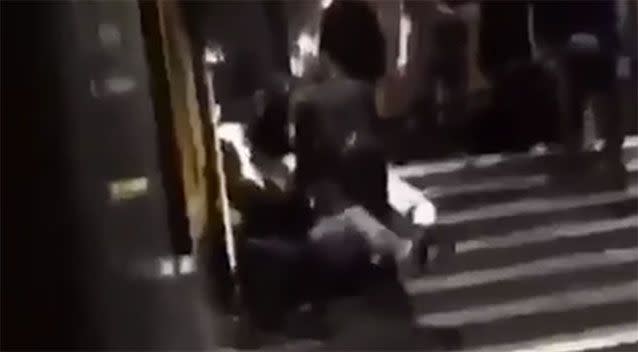 The footage shows the brawl ended up on the pavement. Source: 7 News.