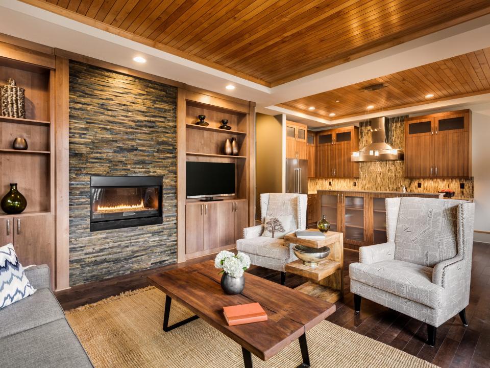 Living room with built in fireplace and wall cabinetry