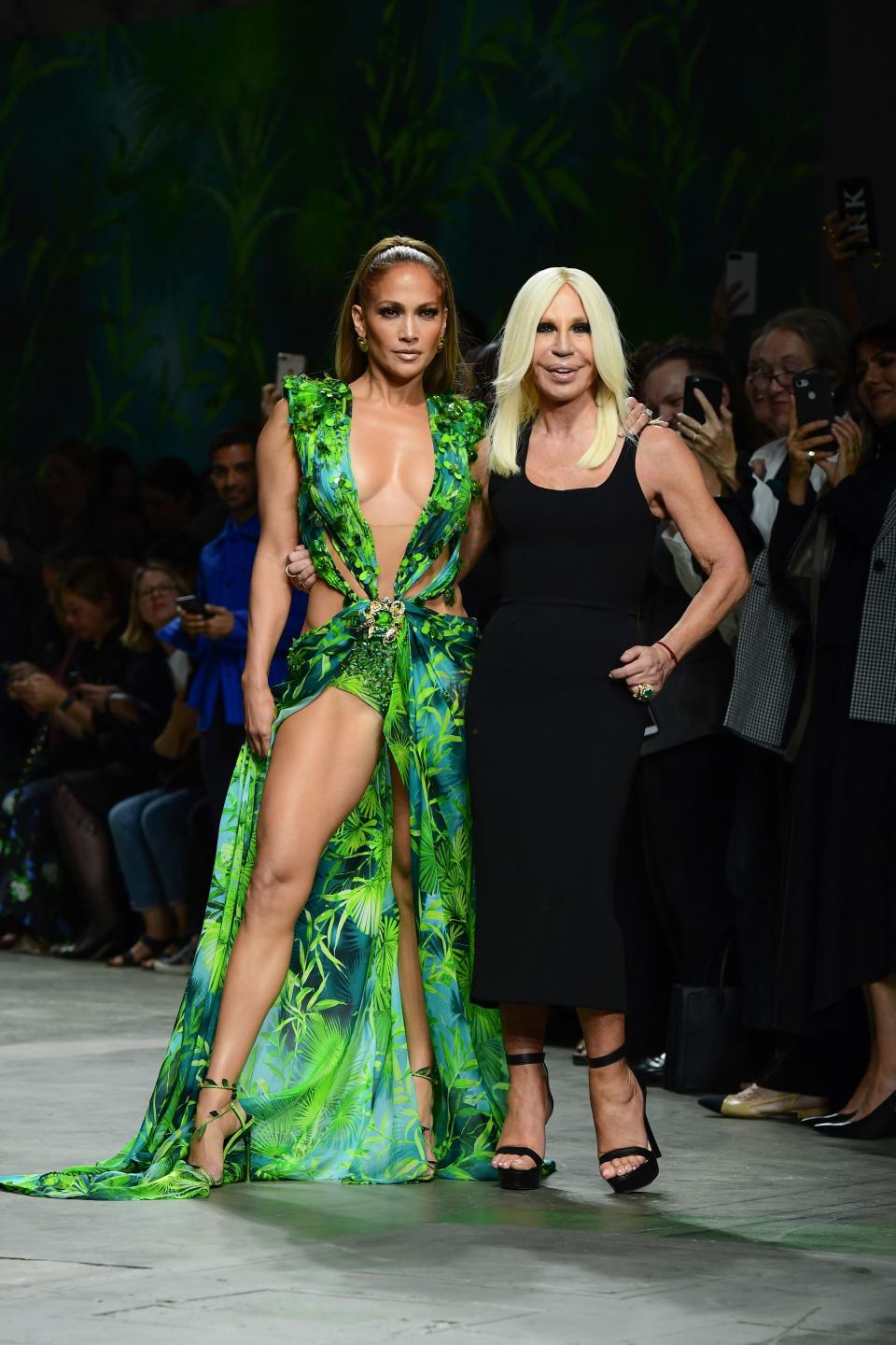 Italian fashion designer Donatella Versace (R) and US singer Jennifer Lopez pose following the presentation of Versace's Women's Spring Summer 2020 collection in Milan on September 20, 2019. (Photo by Miguel MEDINA / AFP)        (Photo credit should read MIGUEL MEDINA/AFP/Getty Images)