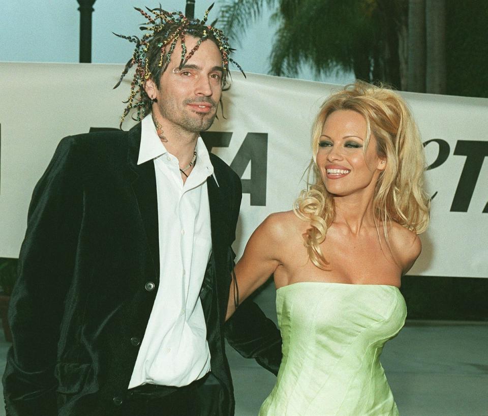 Pamela Anderson and first husband Tommy Lee (Lucy Nicholson / AFP via Getty Images)