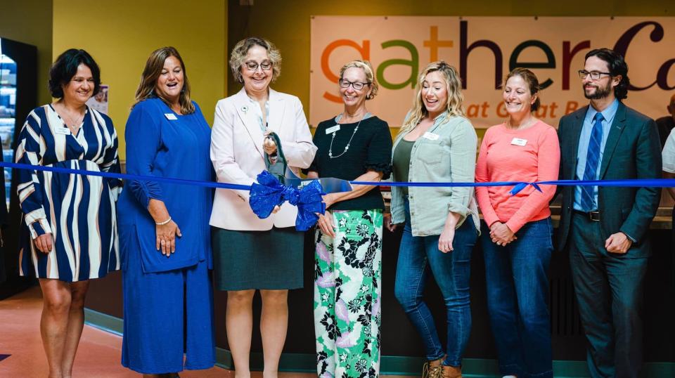 Cheryl Lesser, president of Great Bay Community College, cuts the ribbon at the grand opening of the Gather Cafe Thursday, Sept. 8, 2022. From left are Tania Marino, director of Cooking 4 Community and Gather Café; Brittanie Mulkigian, director of student life at GBCC, Lesser, Patti Gormley, Gather's development director; Analycia Call, Gather's human resources; Stacy Whittier, Gather's Cooking 4 Community manager and Justin Jarvis, Gather's board of directors chair.