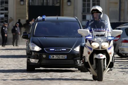 Police officers escort vehicles thought to be transporting Mehdi Nemmouche, 29, the French national who is suspected of the shooting attack in the Brussels Jewish Museum last month that left four people dead, as he leaves after an extradition hearing at the Appeal Court of Versailles, near Paris, June 26, 2014. REUTERS/Benoit Tessier