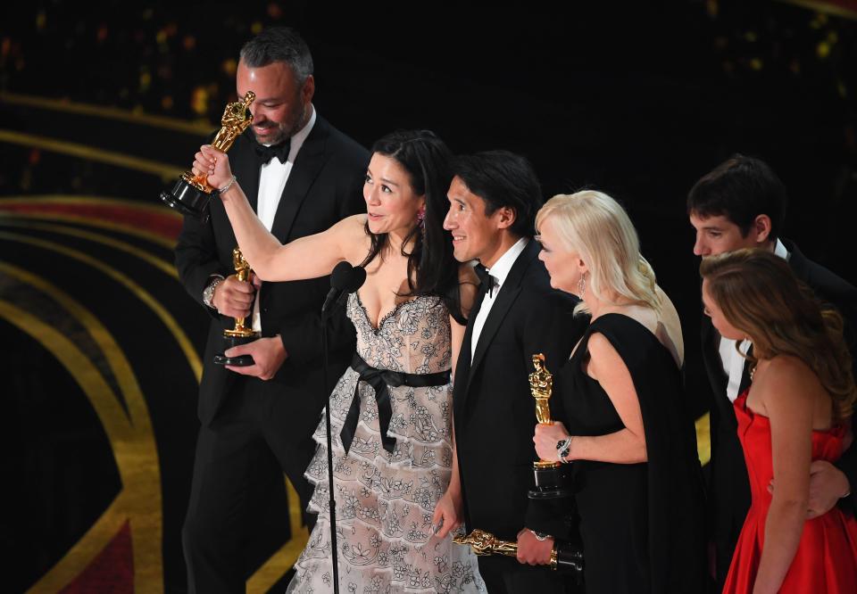 Elizabeth Chai Vasarhelyi, Jimmy Chin, Evan Hayes and Shannon Dill accept Oscar for best documentary feature for "Free Solo."