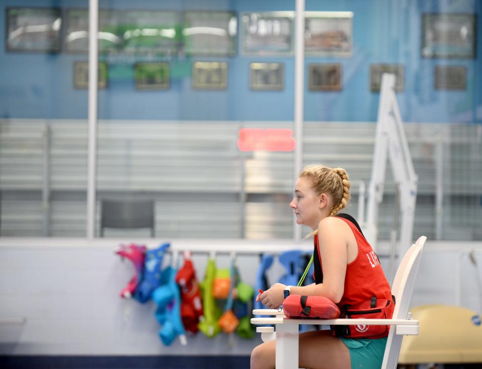 Lifeguard Grace Reed watches over the pool at Paul and Carol David YMCA of Jackson Township. Many pools are struggling to attract lifeguards.