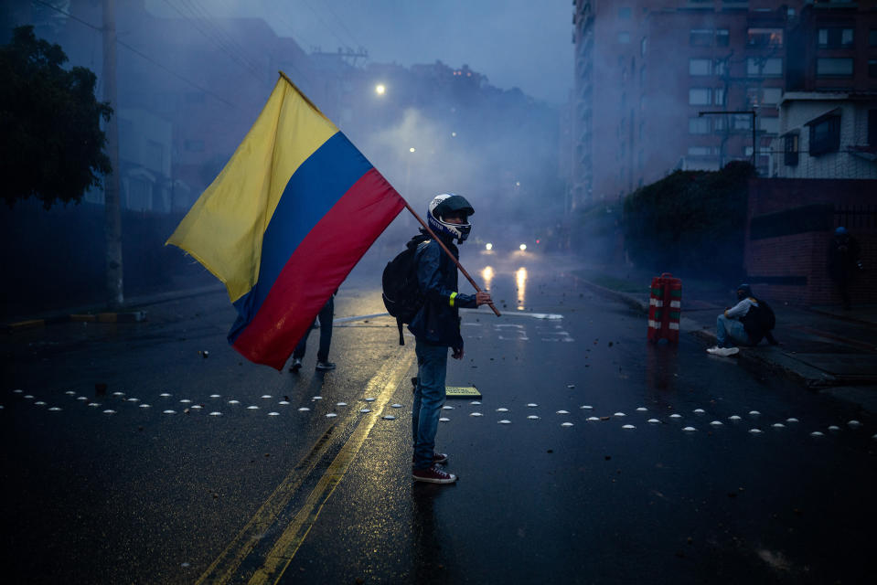 A protester holds a Colombian flag during protests in Bogotá on May 1.<span class="copyright">Andres Cardona—Reojo Colectivo</span>