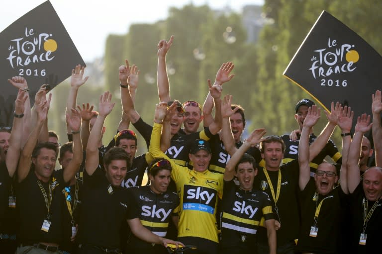 Tour de France 2016's winner Great Britain's Chris Froome celebrates with his teammates and staff members of Great Britain's Sky cycling team