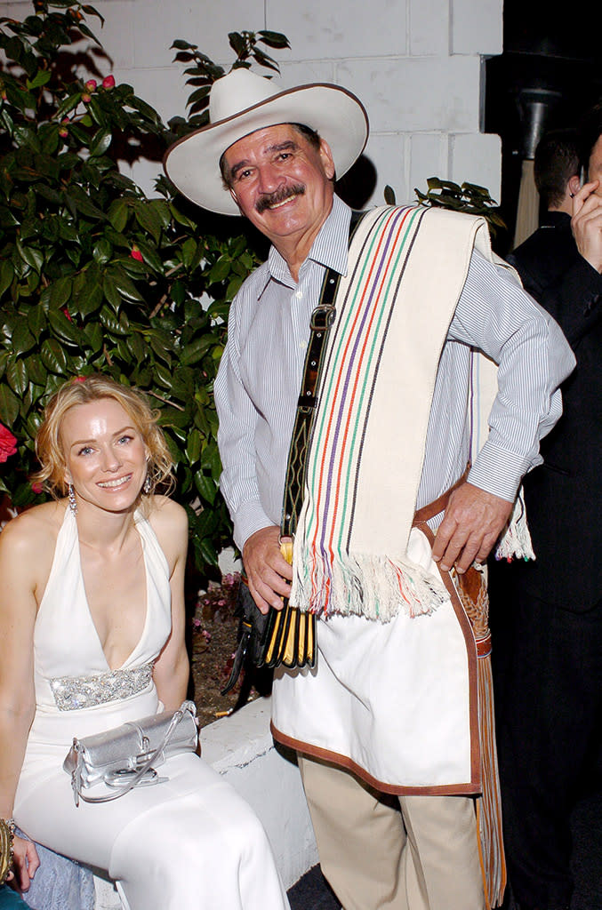 <p>More coffee? Carlos Sanchez, in his Colombian coffee man Juan Valdez outfit, sidled up to Watts in 2005. She looked as if she needed a pick-me-up — or maybe just some flats! — right about then. (Photo: L. Cohen/WireImage for Glamour Magazine) </p>