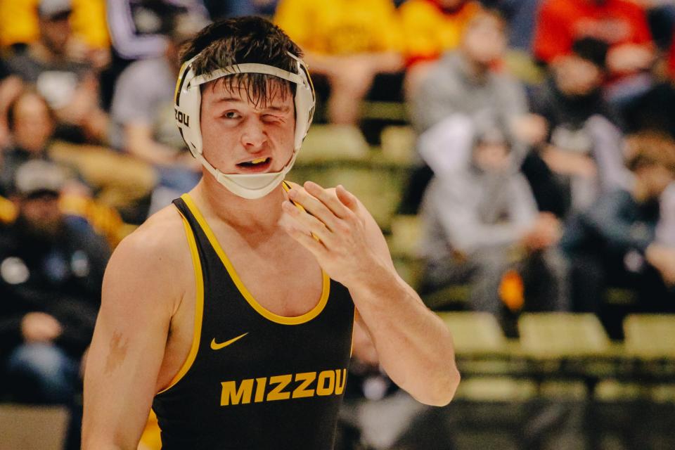 Missouri's Keegan O'Toole reacts after getting hit in the eye during the Tigers' 17-16 loss to No. 5 Iowa State on Wednesday at the Hearnes Center. O'Toole won his match by major decision.