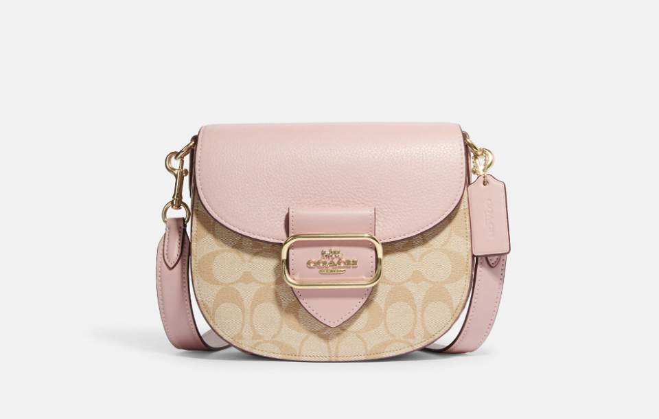 Morgan Saddle Bag in light khaki and powder pink (Photo via Coach Outlet)