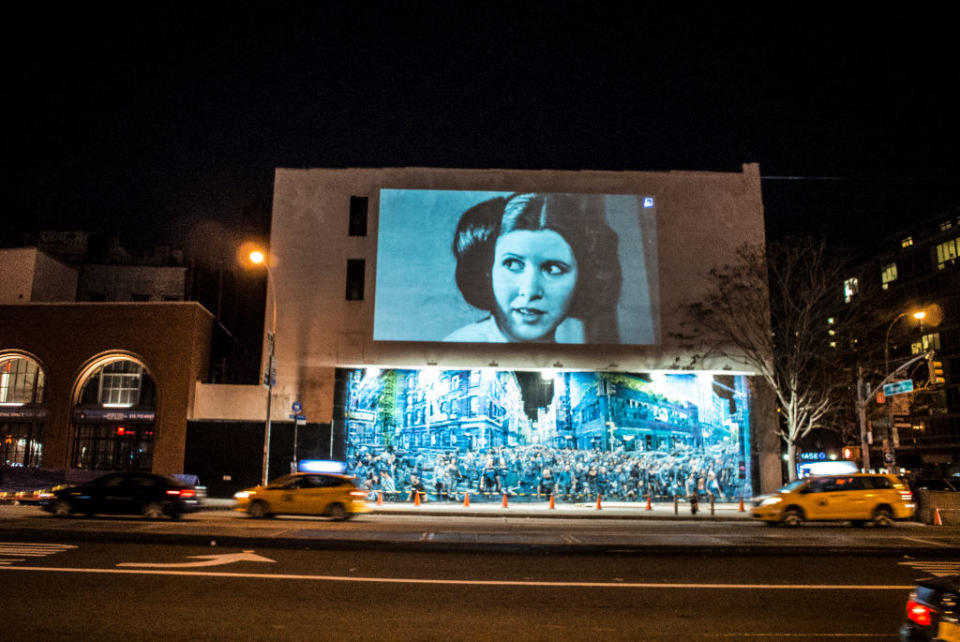 carrie fisher as laila being projected to the side of a buidling