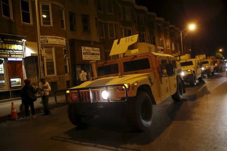 Maryland National Guard vehicles are seen along Pennsylvania Avenue two days after it was looted and set ablaze in protest against the death Freddie Gray, a 25-year-old black man who died in police custody, in Baltimore, Maryland April 29, 2015. REUTERS/Shannon Stapleton