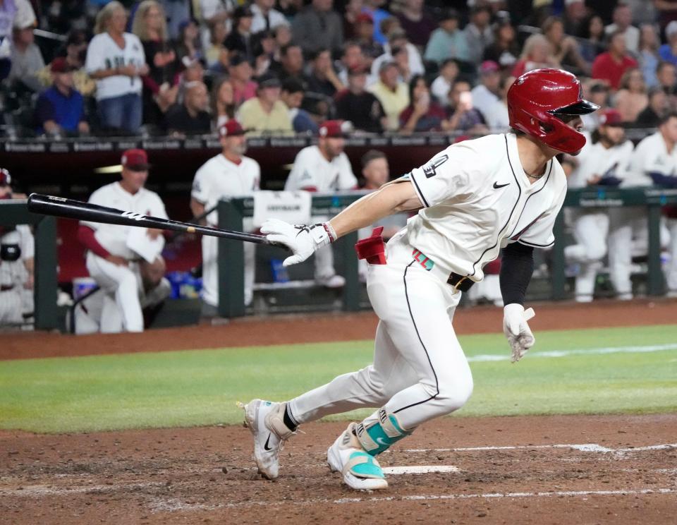 Arizona Diamondbacks center fielder Corbin Carroll (42) tosses his bat after an RBI single against the Chicago Cubs during the eighth inning at Chase Field in Phoenix on April 15, 2024. All players are wearing number 42 in honor of Jackie Robinson Day.