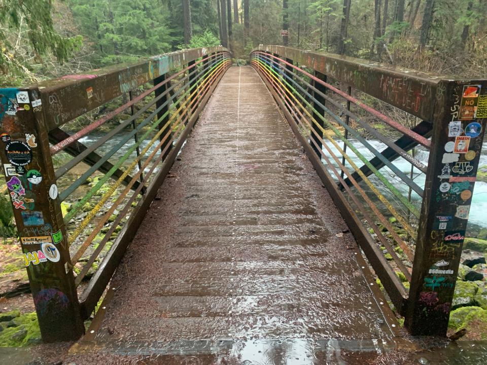 The bridge to Umpqua Hot Springs has been painted colorful hues by its many visitors.
