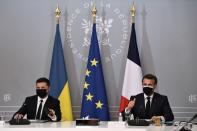 French President Emmanuel Macron and Ukrainian President Volodymyr Zelenskiy hold a news conference following their meeting at the Elysee Palace in Paris