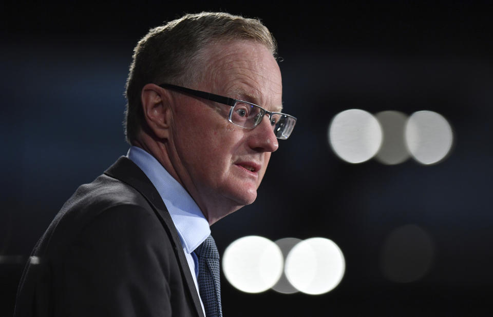 Reserve Bank of Australia Governor Philip Lowe addresses the National Press Club in Sydney, Wednesday, Feb. 5, 2020. The wildfires will slow growth by 0.2 percentage points in the six months through March, Lowe told the National Press Club. (Joel Carrett/AAP Image via AP)