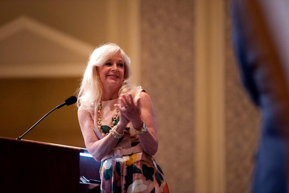 Janet Levy accepts the Volunteer of the Year award. MEGHAN MCCARTHY/Palm Beach Daily News