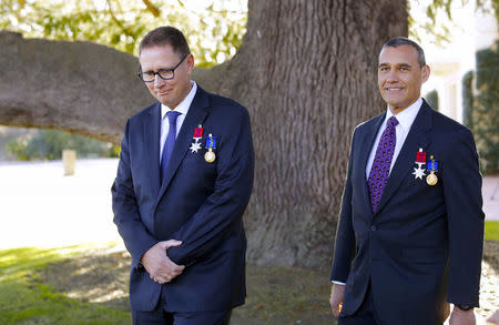 Australia's Craig Challen and Richard Harris, who were part of the Thailand cave rescue team, stand together after an official ceremony at Government House in Canberra, Australia, July 24, 2018. AAP/Sean Davey/via REUTERS