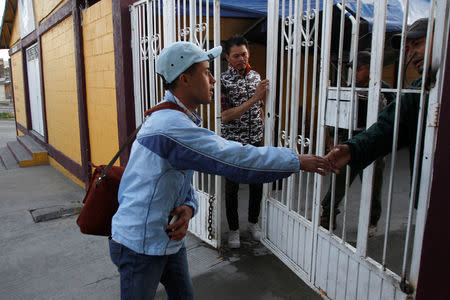 Honduran migrant Ariel, 19, who is waiting for his court hearing for asylum seekers, that have been returned to Mexico to await their legal proceedings under a new policy established by the U.S. government, leaves a shelter in Tijuana, Mexico, March 19, 2019. REUTERS/Jorge Duenes