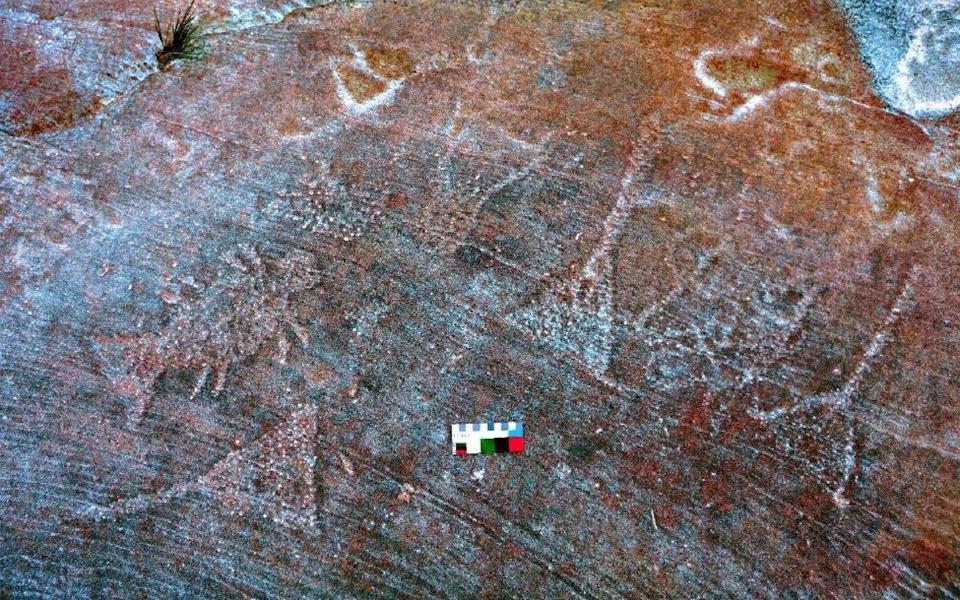 This image shows some of the petroglyphs, rock drawings carved into the rocks.